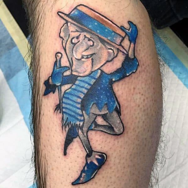 Christmas tattoo of Snow Miser from *The Year Without a Santa Claus*, featuring his iconic blue outfit, top hat, and playful pose for a festive holiday design.
