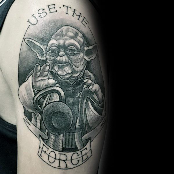 Black and gray tattoo of Yoda holding a kettlebell with the phrase "Use the Forge," blending Star Wars and fitness themes in a bold design.