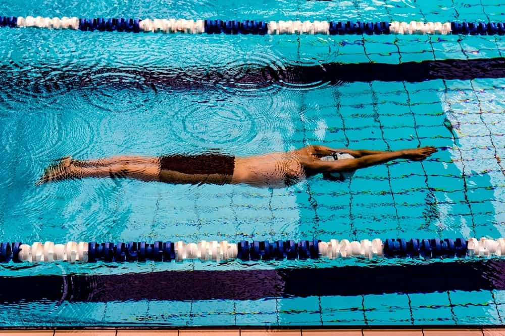 young man swimming in pool