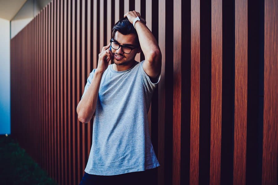 young man upset with having problem talking on mobile