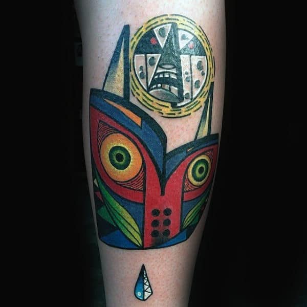Zelda Abstract Majoras Mask Tattoo On Male