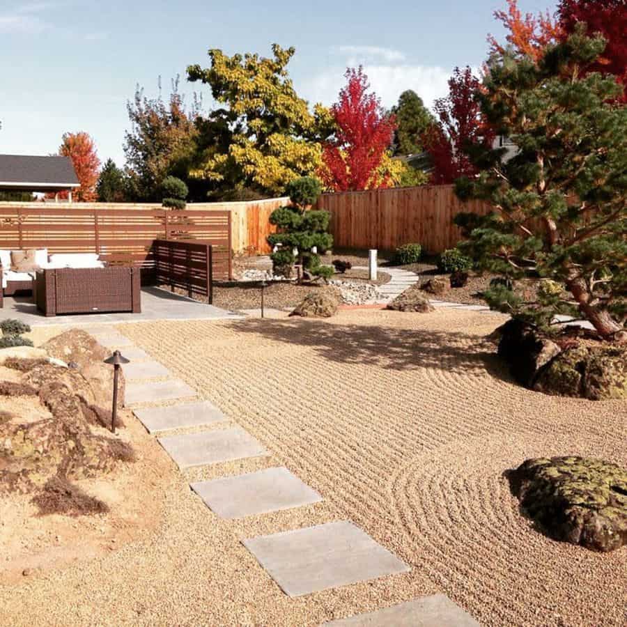 large japanese garden with raked sand paver path wicker furniture 