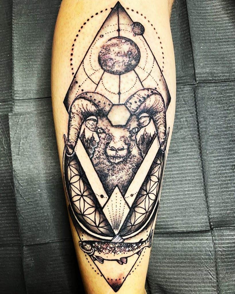 Leg tattoo of a ram with geometric shapes, celestial elements, and intricate dot work, blending nature and mysticism in a bold design.
